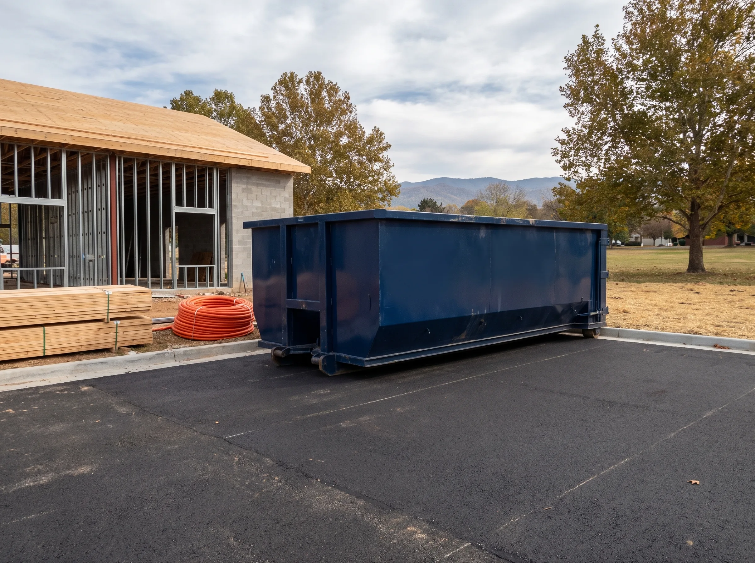 Roll-off dumpster being loaded in Wyoming